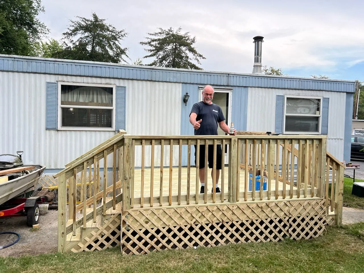 New deck installation with happy customer